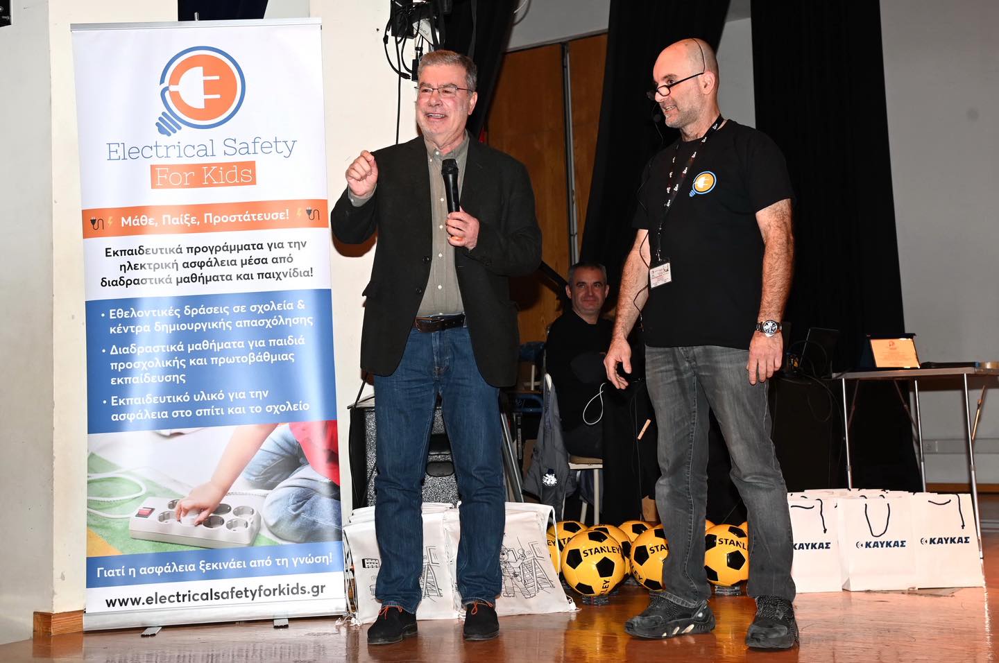 Μπορεί να είναι εικόνα ‎κείμενο που λέει "‎G Electrical ical Safety For Kids ย ทร Μάθε, Παίξε, Προστάτευσε! Εκπαιδευτικά προγράμματα για την ηλεκτρική ασφάλεια μέσα σφάλειαμέσα απο διαδραστικά μαθήματα και παιχνίδια! ·Εθελοντικές! δράσεις σχολεία & κέντρα δημιουργικής απασχόλησης Διαδραστικά μαθήματα νιαπαιδιά παιδιά προσχολικης και πρωτοβάθμιας ·Εκπαιδευτικό υλικό για την ασφάλεια στο σπίτι και το σχολείο Γιατί ασφάλεια ξεκινάει από τη γνώση! www.electricalsafetyforkids.gr G STANLEY STA STAKL سها KAYKAY (.KAYKAZ <-ΚΑΥΚΑΣ‎"‎